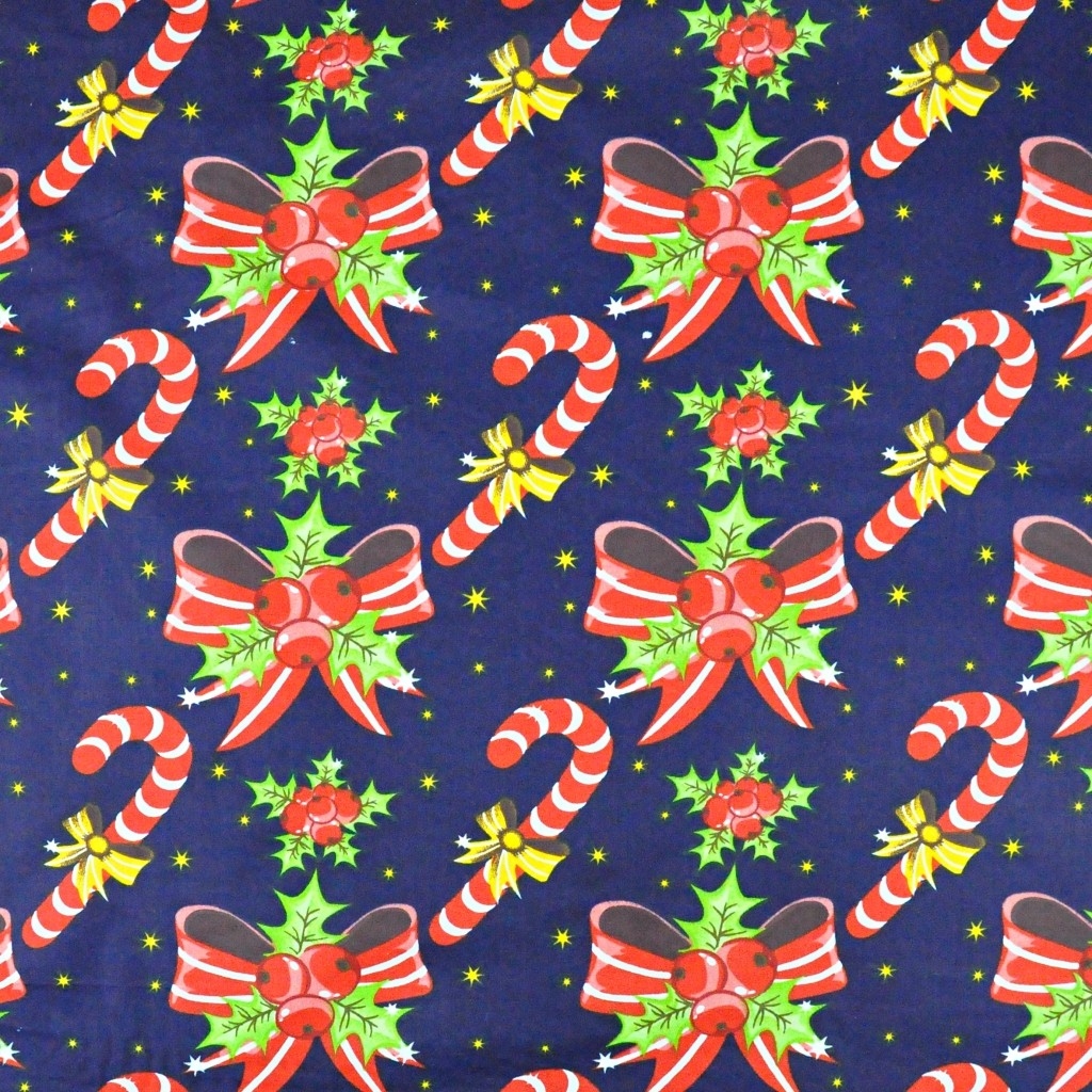 Bawełna wzór świąteczny kokardki i laski na granatowym tle