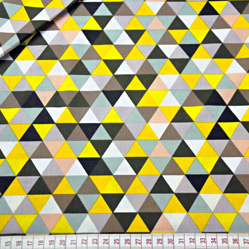 Tkanina w trójkąty małe kolorowe żółte na białym tle