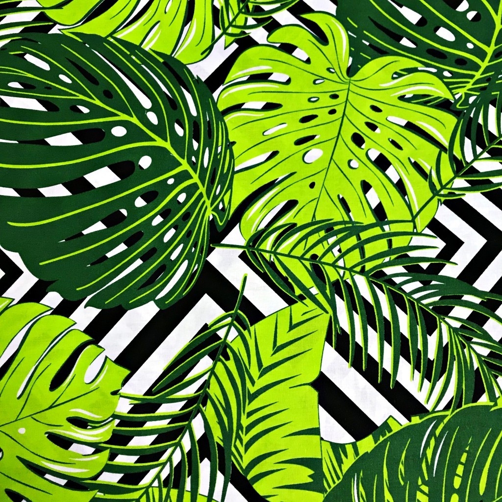 Tkanina w liście zielone na czarnych rombach na białym tle
