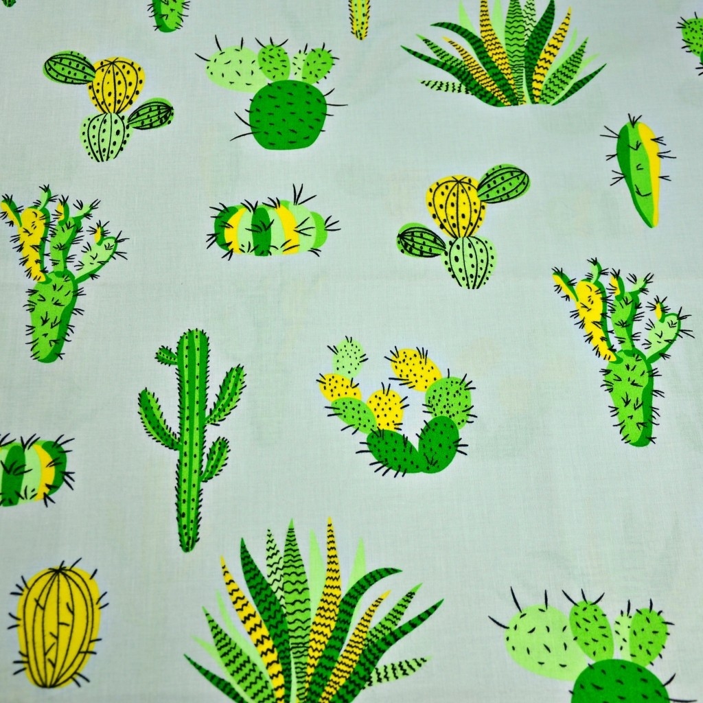 Tkanina w kaktusy zielone na szarym tle