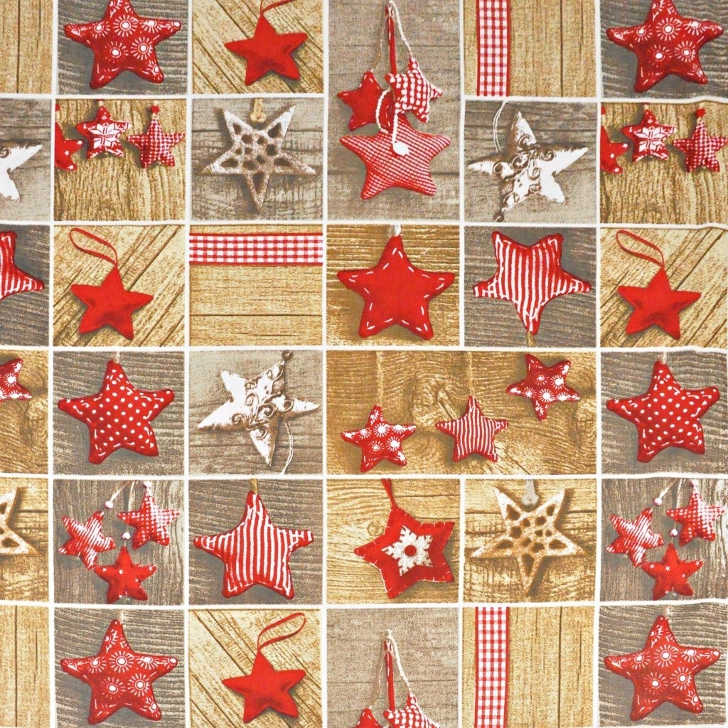 Patchwork Christmas pattern with red stars on wooden board